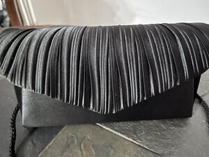 Modern, Sleek designer Clutch by Jessica McClintock. Snag It Fast, It Won’t Last